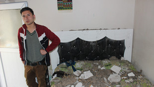 Evlerine düşen roket mermisinden şans eseri kurtuldu