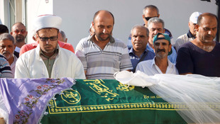 Baba ve çocukları yan yana gömüldüler